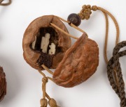 Five assorted Chinese carved nut ornaments and amulets, 20th century. - 2