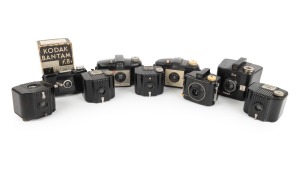 KODAK: Group of c. 1930s black Bakelite rollfilm cameras; the tallest 9cm. (9 items)