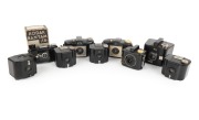 KODAK: Group of c. 1930s black Bakelite rollfilm cameras; the tallest 9cm. (9 items)