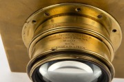 TAYLOR, TAYLOR & HOBSON: Early-20th century large format Series V Cooke Process brass lens [#19777], "20 x 16 inches - eq. focus 25.2 inches", iris diaphragm, focal length approx. 90mm, on 20.5 x 20cm brass lens board; "Sold by Penrose & Co. London". - 2