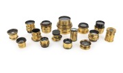 VARIOUS MANUFACTURERS: Group of late-19th century brass lenses; various makers present, including J.H. Dallmeyer, J. Lancaster & Son, R. Morrison New York, and Taylor Taylor & Hobson; the largest diameter 5cm. (15 items)