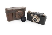 LEITZ: Black-body Leica III (Mod. F) rangefinder camera [#121531], c. 1933, with Elmar 50mm f3.5 lens, Leica lens cap, and Leica leather case.