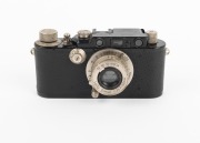 LEITZ: Black-body Leica III (Mod. F) rangefinder camera [#121531], c. 1933, with Elmar 50mm f3.5 lens, Leica lens cap, and Leica leather case. - 2