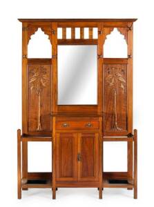 HALLSTAND: Fiddleback blackwood from the workshop of ROBERT PRENZEL. Central mirror flanked by two carved relief panels of gum blossoms, leaves & birds. Similar panels can be found illustrated in literature on Prenzels work. Height 213cm, width 140cm, dep