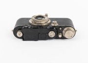 LEITZ: Black-body Leica III (Mod. F) rangefinder camera [#121531], c. 1933, with Elmar 50mm f3.5 lens, Leica lens cap, and Leica leather case. - 5