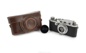 LEITZ: Leica III (Mod. F) rangefinder camera [#306924], c. 1933, with Hektor 50mm f2.5 lens, Leica lens cap, and Leica leather case.