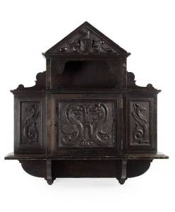 ROBERT PRENZEL Wall Cabinet: Single door with carved dragons,& palladium top with monogram in shield. Reverse with carved details "TREEDE & PRENZEL, Stuart St S.M. Eourpean Labor". Height 86cm, width 80cm, depth 18.5cm