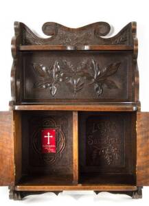 The Sassafras Memorial Cabinet: Queensland maple 2 door wall cabinet carved with assorted leaves. Carved inside "LEAVES OF SASSAFRAS". Early 20th century. Height 66cm, width 43.5cm, depth 20cm