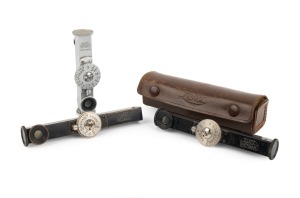 LEITZ: Group of rangefinder attachments, comprising FODIS (black/nickel; feet scale; in leather case), FODIS (black/nickel; meter scale), and FOKOS (chrome). (3 items)