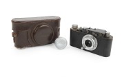 LEITZ: Black-body/chrome fittings Leica II (Mod. D) rangefinder camera [#78479], c. 1932, with Hektor 28mm f6.3 lens, Leica lens cap, and Leica leather case.