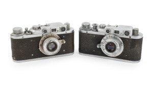 FED: Pair of post-war Fed 1-type rangefinder (Leica copy) cameras [#80124 & #697213], both with FED 50mm f3.5 lenses.
