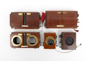 Group of c. 1910s roller-blind shutters, comprising three stereo Thornton-Pickard, one monoscopic Thornton-Pickard with Ross Rapid Symmetrical 7&frac14; x 4&frac12; brass lens [#27661], and one other. (5 items)