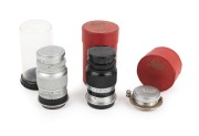LEITZ: Group of lenses, all with Leica caps, comprising EKURZ Elmar 35mm f3.5 (in maker's box), ELANG Elmar 90mm f4 [#220742] (black/chrome; in maker's box), and Elmar 90mm f4 [#1037211] (in plastic capsule). (3 items)