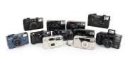 PLASTIC POINT-AND-SHOOT CAMERAS: 1980s-90s group, the brands comprising Fujifilm (2), Konica (4), Minolta, Pentax (2), and Samsung (2). (11 items)