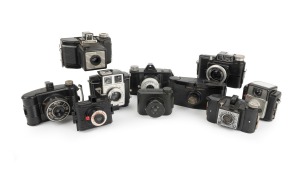 BLACK BAKELITE CAMERAS: Circa 1940s-50s group, with brands including Agfa, Coronet, Dalka, Ferrania, Kodak, and Purma. (10 items)