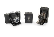 ZEISS IKON: Group of c 1930s cameras, comprising Ica Icarette, Zeiss Ikon Baby-Box, and Zeiss Ikon Nettar 515/16. (3 items)