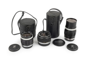 OLYMPUS: Group of lenses, all with front and rear caps present, comprising G. Zuiko Auto-W 25mm f2.8 (with case), E. Zuiko Auto-T 100mm f3.5 (with Olympus UV lens filter, and case) and OM-System G. Zuiko Auto-W 35mm f2.8. (3 items)