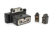 CORONET: Two "Midget" black-Bakelite miniature viewfinder cameras, c. 1935, together with a Coronet 3-D Binocular Viewfinder. (3 items)