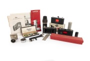 LEITZ: An accumulation of accessories including a copy stand, film trimmer template, transparency viewer, some ephemera, and much else besides. (qty.)