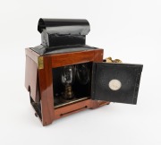 Large c. 1890s mahogany and brass MAGIC LANTERN with rack-and-pinion lens, tin chimney element, side-opening door with red glass peephole, "W. Watson & Sons 251 Swanston St Melbourne" retailer's plate; later retrofitted for electricity, dimensions approx. - 3