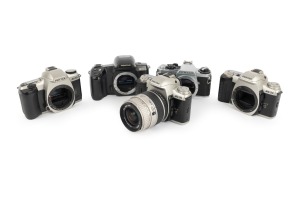 ASAHI KOGAKU: Group of 1990s-2000s SLRs, comprising Pentax MR Super (body only), Pentax MZ-30 (body only), Pentax MZ-50 (Sigma Zoom 28-80mm f3.5-5.6), Pentax MZ-50 (body only), and Pentax Z-10 (body only). (5 items)