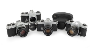 ASAHI KOGAKU: Group of 1960s-70s SLRs, comprising Pentax K1000 (SMC Pentax-M 50mm f2), Pentax Spotmatic (Super-Takumar 55mm f2, with cap and leather case), Pentax Spotmatic (body only), and Pentax Spotmatic F (Fujinon 55mm f1.8). (4 items)