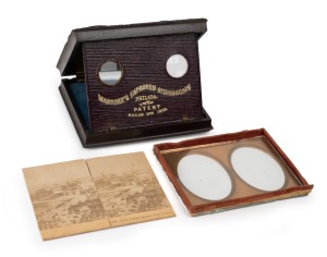 Flip-up pocket stereoscope stamped "Mascher's Improved Stereoscope/Philada./Patent March 8th 1853", in embossed leather case with stereo view of Paris; dimensions 3 x 10 x 12.5cm when closed.