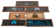 Group of mid-19th century panoramic slipping slides, the largest 10 x 38cm overall; rail, shipping (noted Niagara Falls), lighthouse, and horse-drawn carriage interest. (7 items)