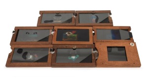 Group of wooden slides, mostly double slipping slide-type; noted Ratcatcher and Bell Rock Lighthouse; the largest 11 x 17.5cm overall. (8 items)