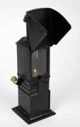19th-century lecturer's lantern projector, lacquered tin, integrated bell and red-glass peephole; height 28cm. - 3