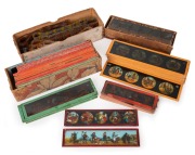 A collection of 60+ toy magic lantern panoramic slides, together with some projector film strips (children's content). (qty.)