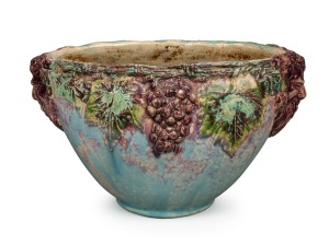 UNA DEERBON impressive pottery vase with applied Bacchanalian face masks, grapes and vines, incised "Deerbon", 20cm high, 34cm wide.