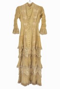 An antique dress, pleated silk and fine cotton with mother of pearl buttons, 19th/20th century.