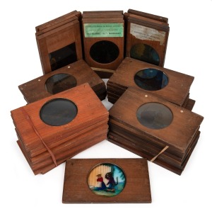 A collection of wooden slides for magic lantern, mostly late-19th century narrative sets, including Robinson Crusoe (12), "Pussy's Road to Ruin" (12), "The Tiger and the Tub" (7), "Vulgar Boy" (6), a dissolving series showing a homestead throughout the se