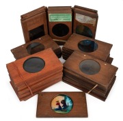 A collection of wooden slides for magic lantern, mostly late-19th century narrative sets, including Robinson Crusoe (12), "Pussy's Road to Ruin" (12), "The Tiger and the Tub" (7), "Vulgar Boy" (6), a dissolving series showing a homestead throughout the se