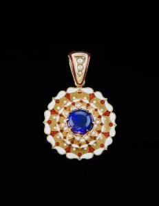 OPAL, ENAMEL AND SEED PEARL PENDANT BY KILPATRICK & CO. c.1875: Of stepped, circular design, set with a central opal crystal framed by seed pearls and radiating orange and white enamel sections. Stamped 'K & Co.18ct'. Weight 14.08 grams.  