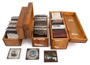 A diverse collection of 83 x 83mm glass slides for magic lantern, housed in three timber cases, the largest 13.5 x 30 x 11cm; mixture of hand-illustrated and photographic types, many narrative sets, noted "His First and Last Cigar". (180+ items)
