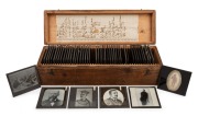 SPIRITUALISM: An interesting collection of 83 x 83mm glass slides for magic lantern, mostly hand-illustrated, including several depicting seances, ectoplasm, etc; housed in 10 x 37 x 11.5cm. (49 items)