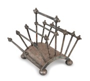 CHRISTOPHER DRESSER designed antique English silver plated toast rack made by HUCKIN & HEATH of Birmingham, circa 1881, stamped "H. & H." with pictorial mark and serial No. 2556. 12cm high, 15cm wide, 10.5cm deep. - 2