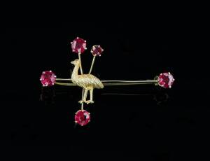 BROOCH BY WILLIS, MELBOURNE: In the form of the Southern Cross and set with garnet topped doublets and a central applied emu. 9ct yellow gold. Weight 2.72 grams.&nbsp;&nbsp;