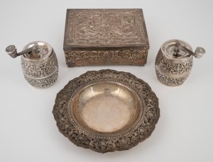 Yogya 800 silver cigarette box with cedar lining, a 900 silver bowl with repousse decoration, and a pair of Southeast Asian silver pepper mills, 20th century, (4 items), the box 13.5cm wide.