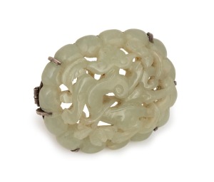 An antique Chinese carved jade brooch with silver mount, 19th/20th century, ​​​​​​​5.5cm wide.