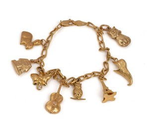 An Italian 18ct gold charm bracelet with charms including 9ct, 14ct and 18ct gold, 20th century, ​​​​​​​12.7 grams total.