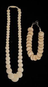 A vintage ivory bead choker necklace, together with a bone bead bracelet, mid 20th century, (2 items), the necklace 42cm long.