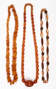 Three assorted vintage amber and bakelite bead necklaces, 20th century, ​​​​​​​the largest 75cm long.
