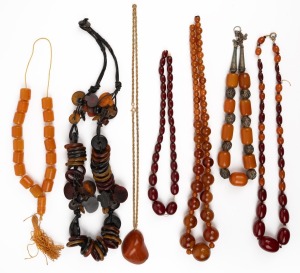 Seven assorted amber and bakelite bead necklaces, 20th century, ​​​​​​​some in need of restringing.