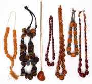 Seven assorted amber and bakelite bead necklaces, 20th century, ​​​​​​​some in need of restringing.