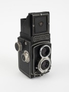 ROLLEI: Rolleicord IV TLR [#1390068], c. 1953, Schneider-Kreuznach Xenar 75mm f3.5 lens [#3875154], Synchro-Compur shutter, Rollei double lens cap, Rollei leather case. - 2