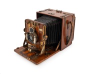 "Tropical Model" mahogany and brass folding camera, c. 1900s, plate dimensions 10 x 12.5cm, Ross London Homocentric 6" f6.3 lens with pneumatic shutter, integrated spirit level.