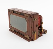 LANCASTER: "Stereo Instantograph" folding stereo camera, c. 1891, plate dimensions 8.5 x 17cm, twin Lancaster brass lenses with iris diaphragms, extremely scarce clip-on brass stereo shutter, red bellows. - 2